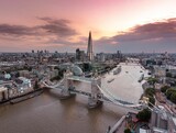 Fototapeta Londyn - Aerial view of Tower Bridge and The Shard at pinky dreamy sunset in London