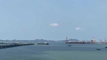 Wall Mural - Aerial view of a container terminal in the import-export business industry in Sriracha Industrial Port, Chonburi, Thailand.