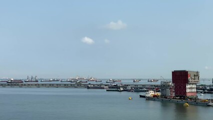 Wall Mural - Aerial view of a container terminal in the import-export business industry in Sriracha Industrial Port, Chonburi, Thailand.