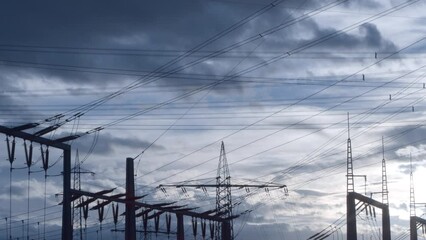 Canvas Print - Beautiful fluffy clouds in the blue sky above powerlines during daytime