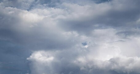 Wall Mural - Scenic view of fluffy clouds in the sky during daytime