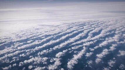 Wall Mural - Aerial view of mesmerizing clouds stretching to the horizon in the sky