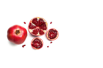 Top view exotic and delicious whole and part of pomegranate on white background with copy space. Created with Generative AI Technology