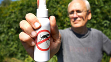 Close-up Of The Hand Of A Man Holding A Mosquito Spray Tube