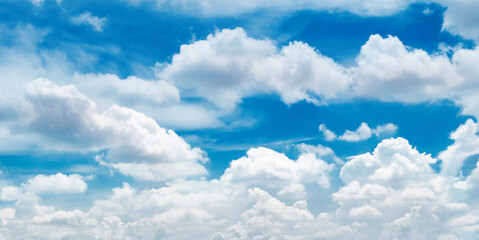 Wall Mural - Large white clouds. Sky with fluffy white cloudscape texture. Wide blue sky nature background, cloudy, horizontal