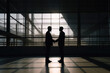 © Bruno - Silhouette of two businessmen men's silhouette shaking hands in a modern office with a view. Generative Ai