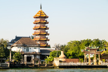 Riverview with temples and pagoda from Chao Phraya in Bangkok, Thailand