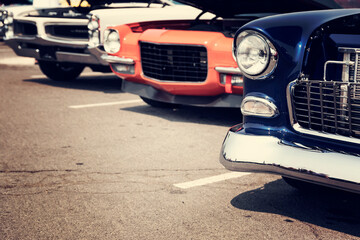 Wall Mural - Vintage cars in a row at a car show on the street