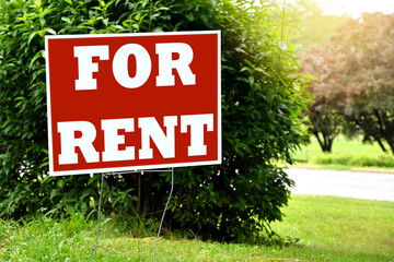for rent sign in a yard - house home office space for rent.