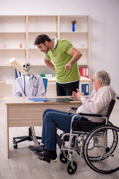 Old patient in wheel-chair visiting skeleton doctor