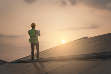 Wall Mural - service engineer checking solar cell on the roof for maintenance if there is a damaged part. enginee