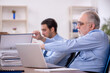 © Elnur - Two male colleagues working in the office