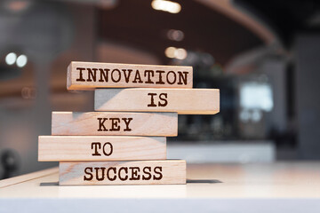 Wall Mural - Wooden blocks with words 'Innovation is key to success'. Business concept