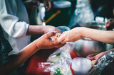 Fototapeta Pomosty - volunteer giving poor homeless bowl of food outdoors : food sharing ideas