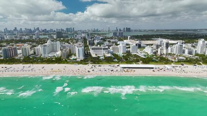 Canvas Print - Miami Beach city with high luxury hotels and condos and sandy beachfront. High angle view of tourist infrastructure in southern Florida, USA