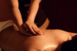 Masseuse hand massage aroma on back a man customer in cosmetology spa centre.