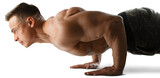 Muscular young muscular guy training in gym