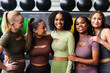 © Flamingo Images - Laughing group of women standing in a gym