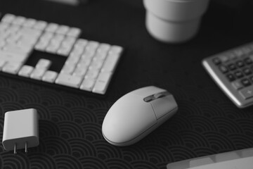 Poster - top view of office desk table with  calculator, notebook, plastic plant, mouse and keyboard.