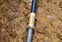Brass Joint Connector Attached To The Old And New Water Pipe 
