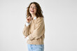 © insta_photos - Young adult smiling beautiful charming positive woman model, joyful satisfied pretty cheerful cute curly girl student looking at camera laughing, standing isolated at white background, portrait.