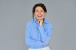 © insta_photos - Happy cheerful young smiling confident professional business woman wearing blue shirt, pretty stylish female executive looking at camera laughing, standing isolated at gray background, portrait.
