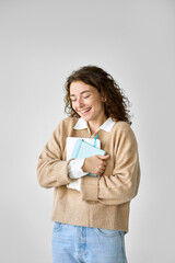 Wall Mural - Young happy pretty cute girl student holding digital tablet standing isolated at white background feeling excited about studying abroad, university admission or getting scholarship, vertical.