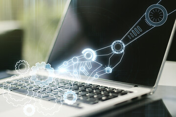 Aufkleber - Creative concept of robotics technology on modern laptop background. Robot development and automation concept. Multiexposure
