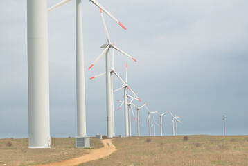 Wind turbines farm that provide enough electricity. Global warming concept and green energy.