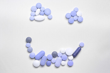 Wall Mural - Assorted pills on a neutral background with light blue colors. Concept of pills used for male erection.