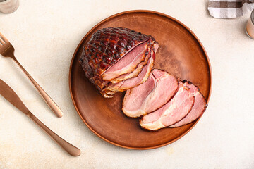 Plate with tasty smoked ham on white background