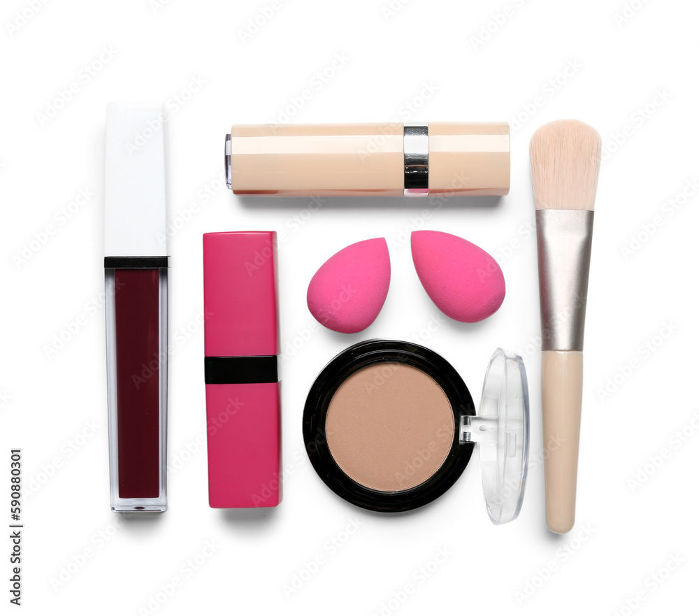 Decorative cosmetics with brush and sponges on white background