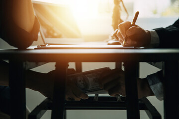 Business and lawyers discussing contract papers with brass scale on desk in office. Law, legal services, advice, justice and law concept picture with film grain effect