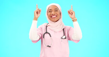 Sticker - Muslim nurse, happy woman and pointing finger portrait with space for healthcare, religion or happiness. Islamic female medical worker with hand, smile and hijab for announcement on blue background