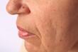 © New Africa - Closeup view of older woman on white background