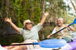 © CandyRetriever  - Asian senior couple kayaking together in the lake at mangrove forest on summer vacation. Retired elderly people man and woman have fun outdoor lifestyle travel nature and rowing a boat in the river.