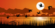duck or teal birds flying over the lake. grass, mountain and sunset background.