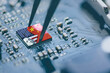 Flag of USA and China on a processor, CPU or GPU microchip on a motherboard. US companies have become the latest collateral damage in US - China tech war. US limits, restricts AI chips sales to China.
