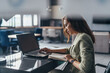 © undrey - Business woman working with laptop at her desk
