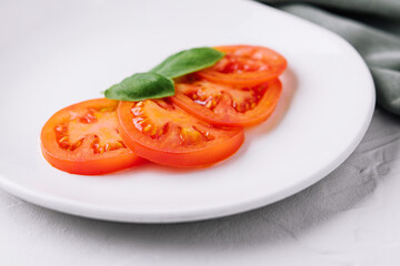 Wall Mural - Sliced red tomatoes and basil leaves