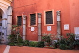 Fototapeta Na drzwi - San Silvestro in Capite Church Courtyard with Red Wall and Ancient Columns in Rome, Italy