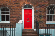Vintage Red Door With Brick Wall.