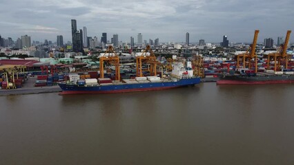 Sticker - Shipping and industrial yard with a cargo ship off shore, drone view