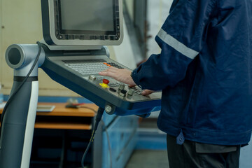 Poster - Engineer controlling robot arm at factory,Checking the operation of robot arm,Innovation and engineering concept.