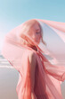 © Uncanny Valley - Elegant girl with pastel pink silk robe, cloak, scarf on summer landscape, desert with hot sand on sunny day. Generative AI.