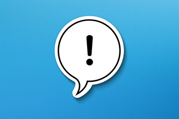 exclamation mark with speech bubble on blue background