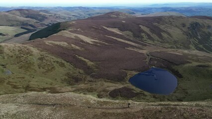 Wall Mural - A hiker walking a mountain ridge in Wales UK