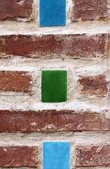 Sticker - old historic brick wall with colorful ceramic