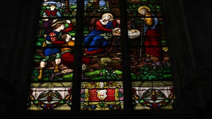 Wall Mural - DIEPPE, FRANCE - SEPTEMBER 17, 2021: Stained glass with a scene of the birth of Jesus Christ