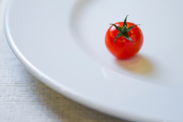 Cherry tomato on a white plate